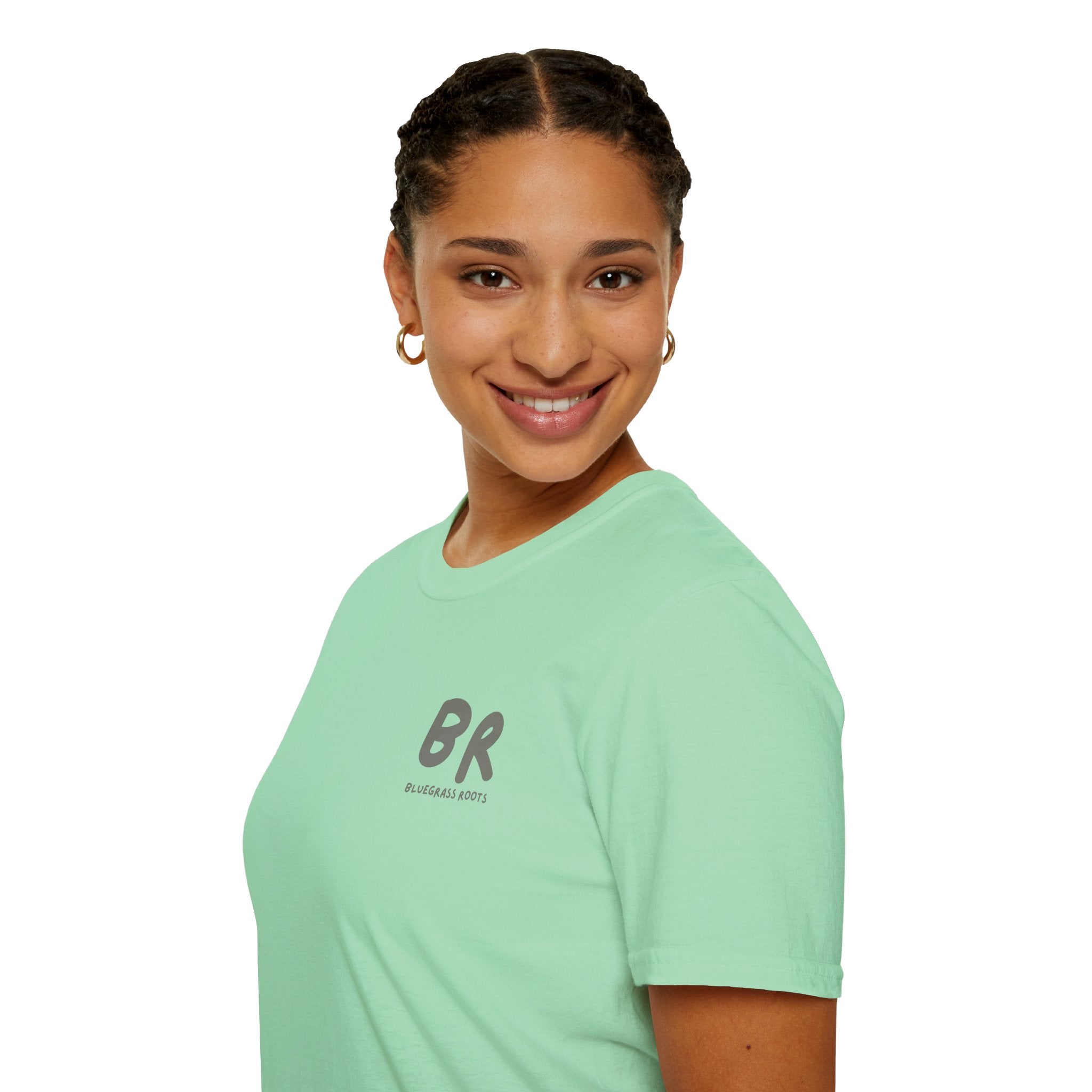 Person wearing a light green t-shirt with a logo on a white background