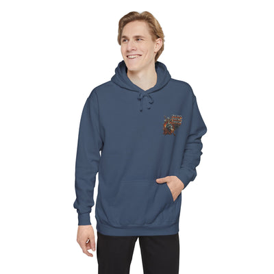 Man wearing a blue hoodie with a logo on a white background
