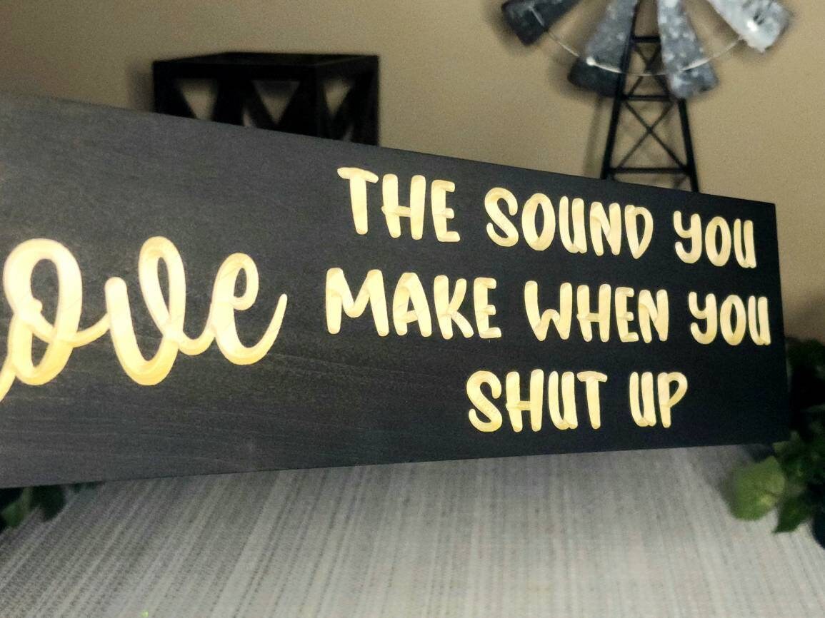 Bold and humorous wooden sign for playful home decor or quirky office accents.