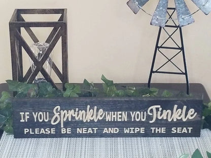 Cheeky bathroom manners sign for playful and practical guest bathroom decor.
