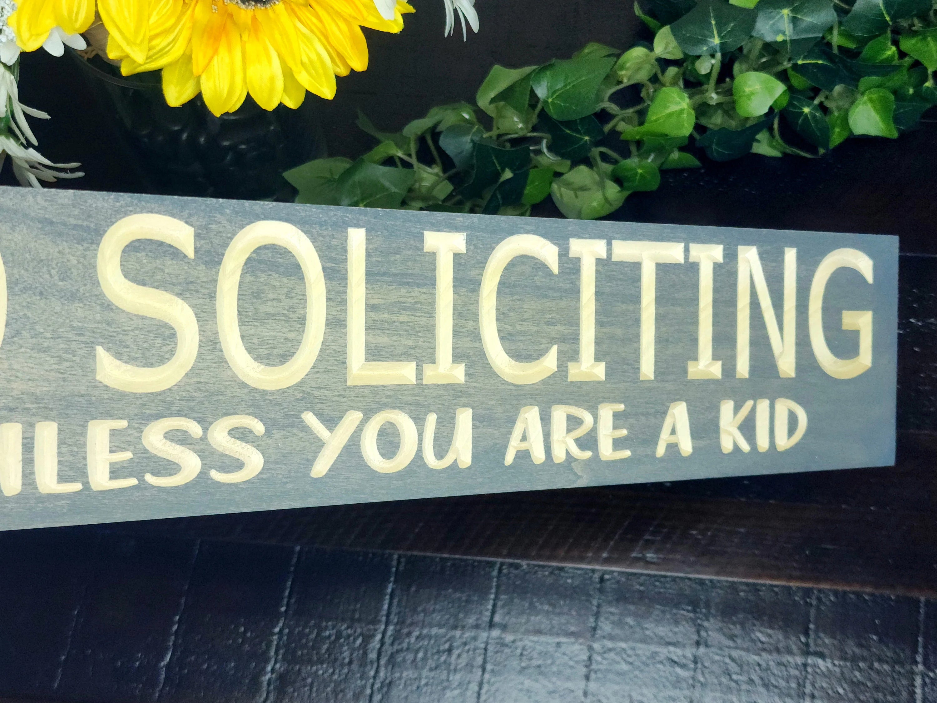 Decorative entryway sign letting guests know the rules with a fun and friendly touch.
