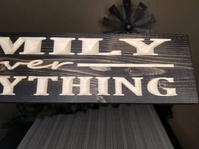 Family loyalty wooden wall art for family rooms, featuring a rustic design.
