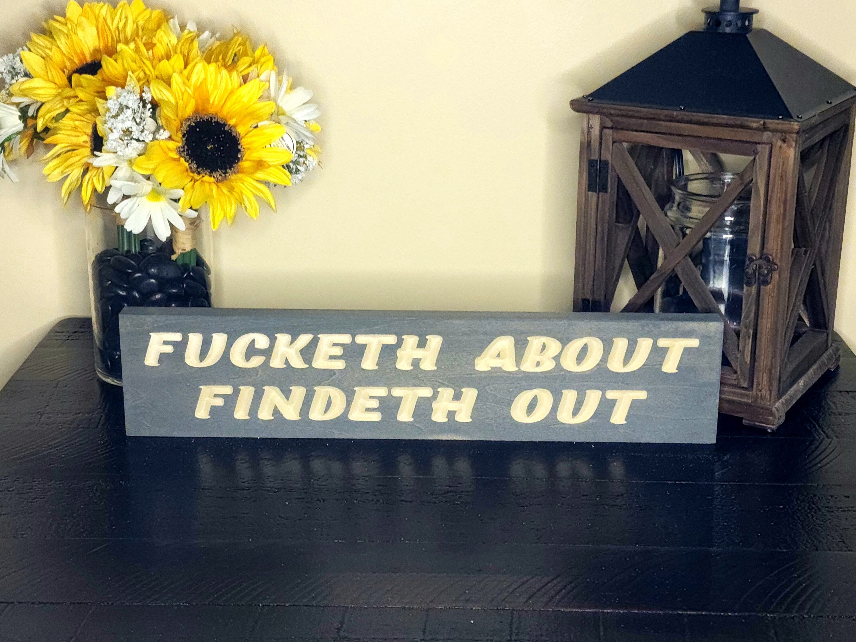 Faux-Shakespearean decor with humorous wood sign for lounges and offices.
