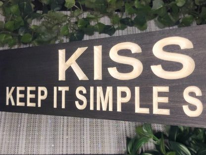 Funny office sign with the K.I.S.S. principle for entrepreneurs.
