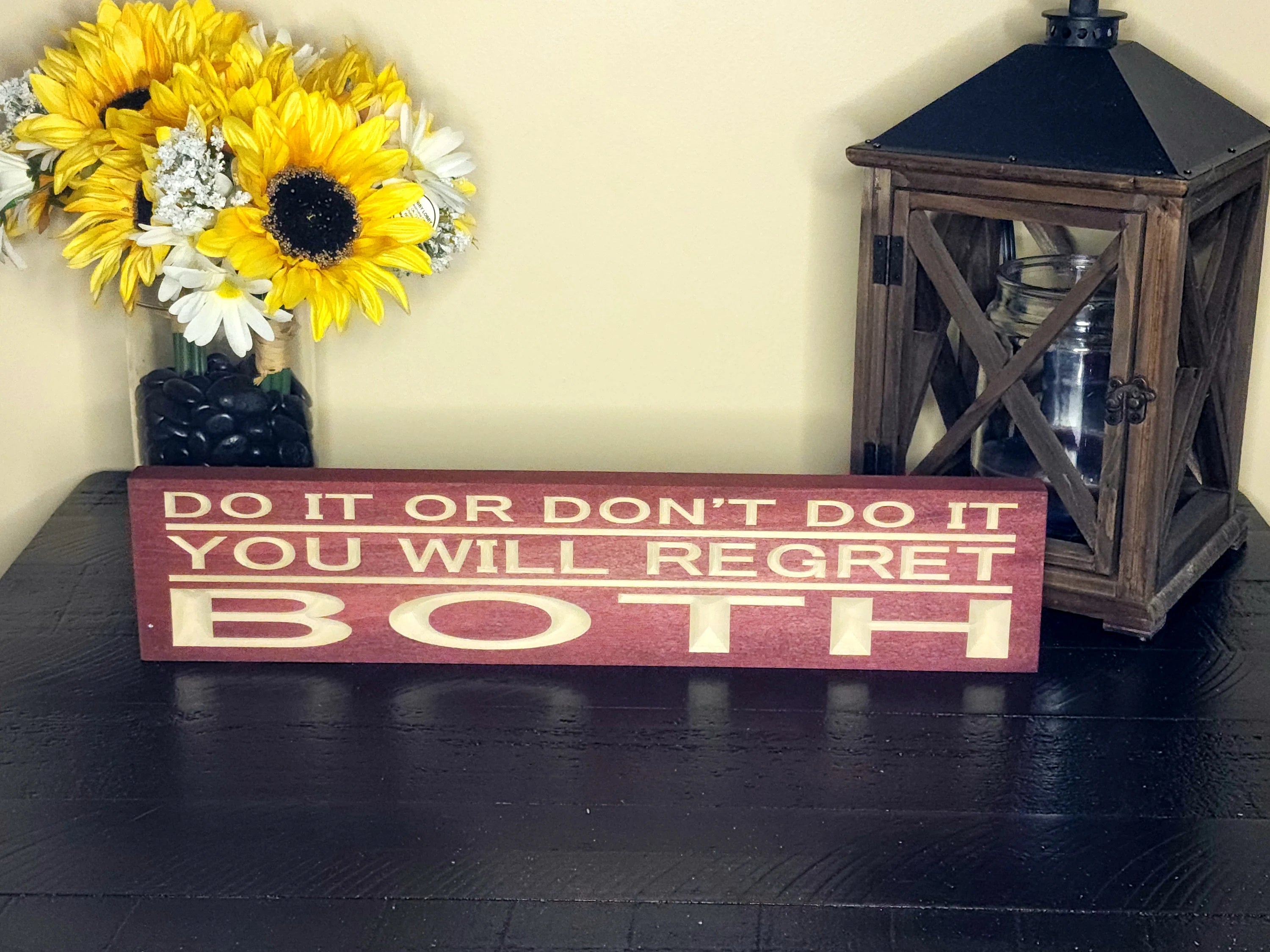 Handmade wood regret quote sign for personal growth and life advice.