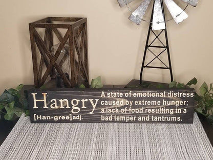 Humorous hangry wall art with hunger humor for playful home accents.
