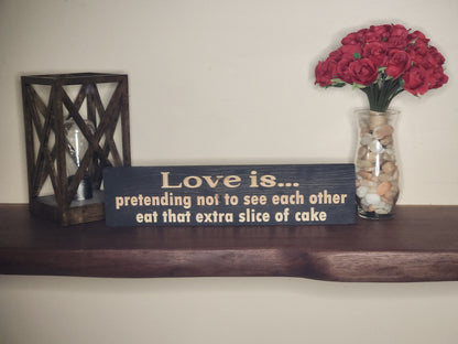 Humorous love quote wood sign for couples with playful cake message