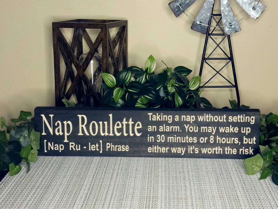 Humorous sleep quote sign for nap lovers and college dorm decor.
