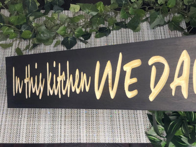 Inspirational kitchen sign for positive home decor and cooking spaces.
