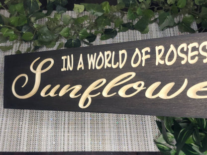 Inspirational sunflower quote sign hanging in a bedroom for daily motivation.
