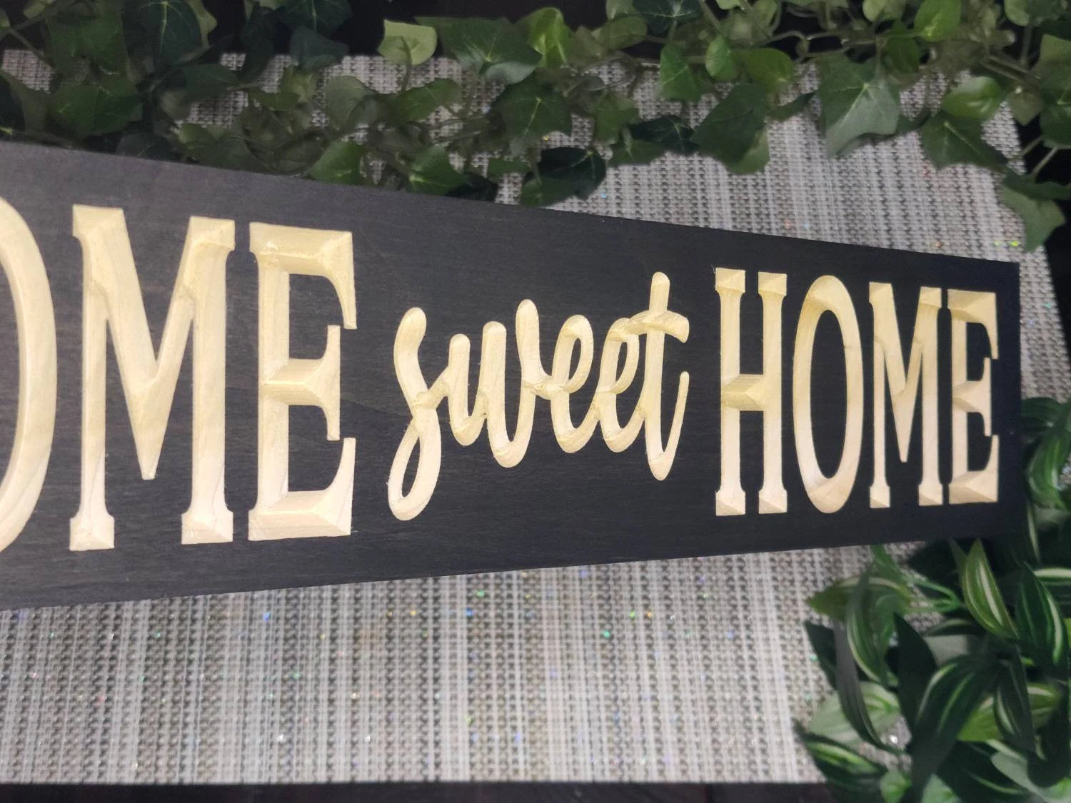 Inspirational wooden home decor sign placed on a fireplace mantel.
