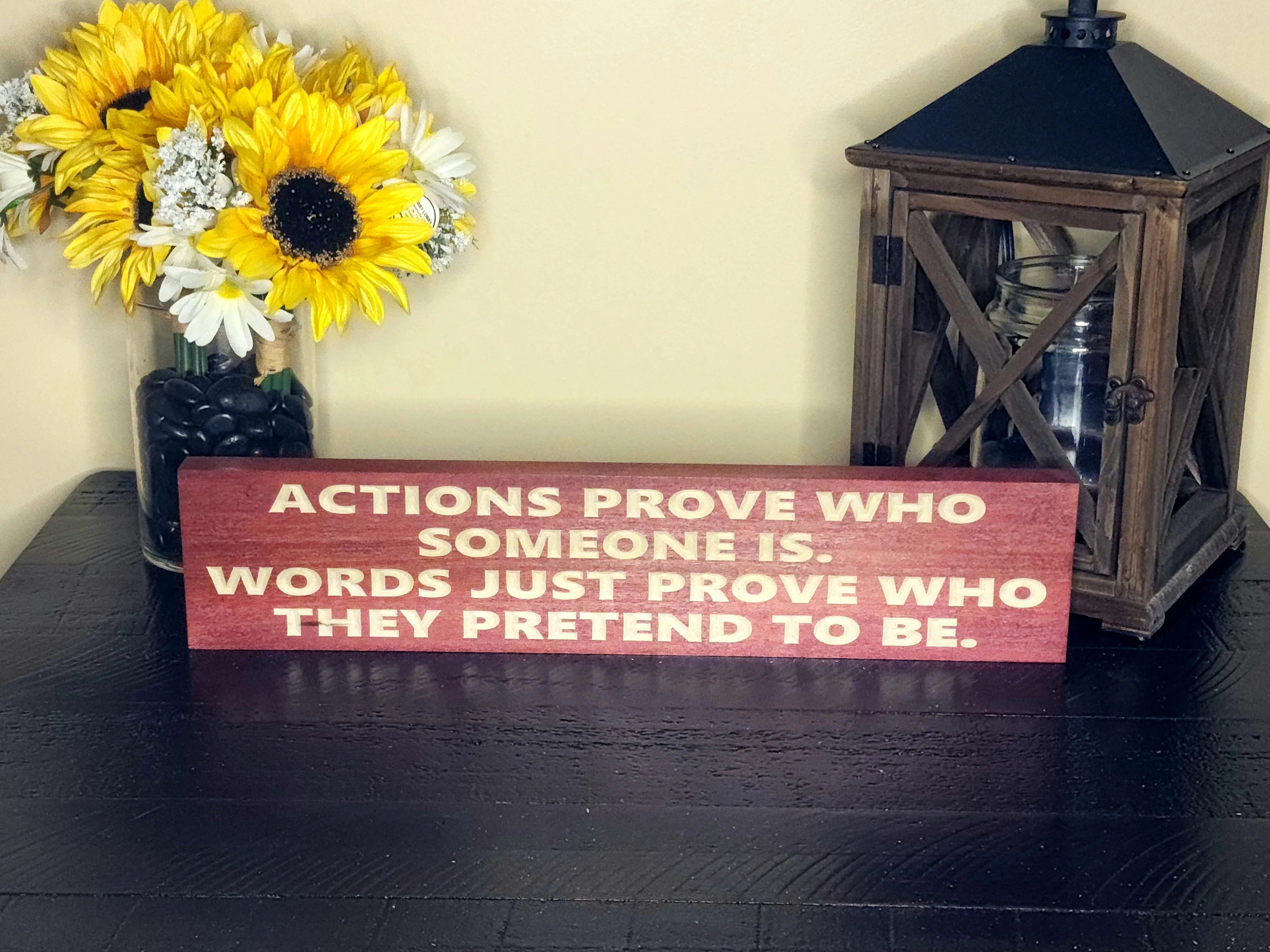 Inspirational wooden quote sign hanging in a rustic farmhouse entryway.
