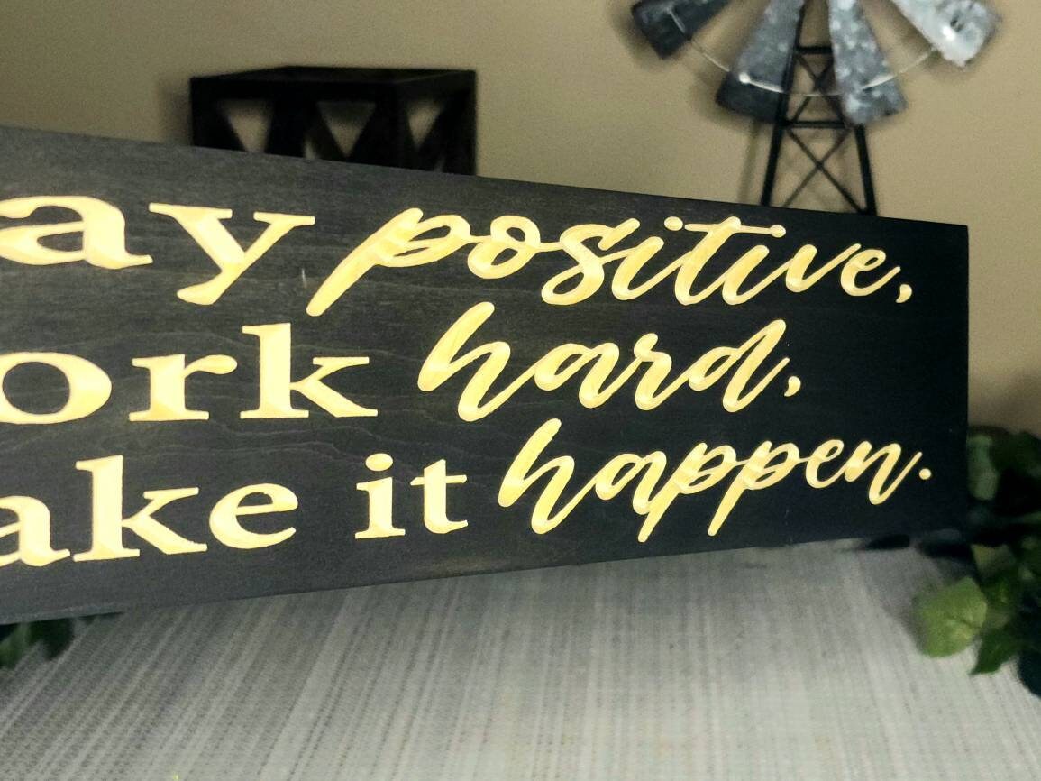 Inspirational wooden sign for home office productivity and motivation.

