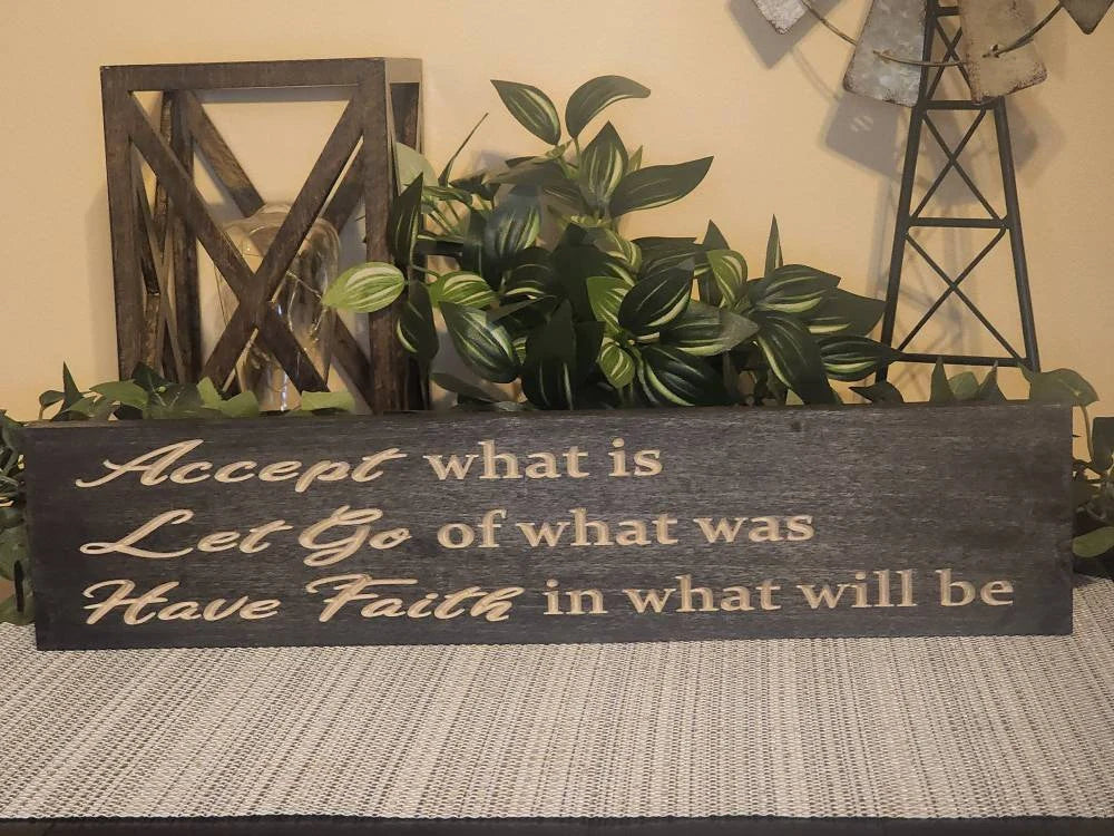 Inspirational wooden sign placed in a meditation space for a calming atmosphere.
