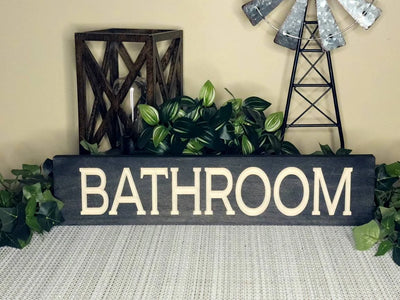 Minimalist bathroom door sign for a modern and elegant space.
