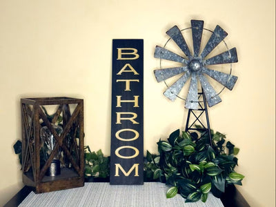 Modern bathroom wall sign with minimalist design
