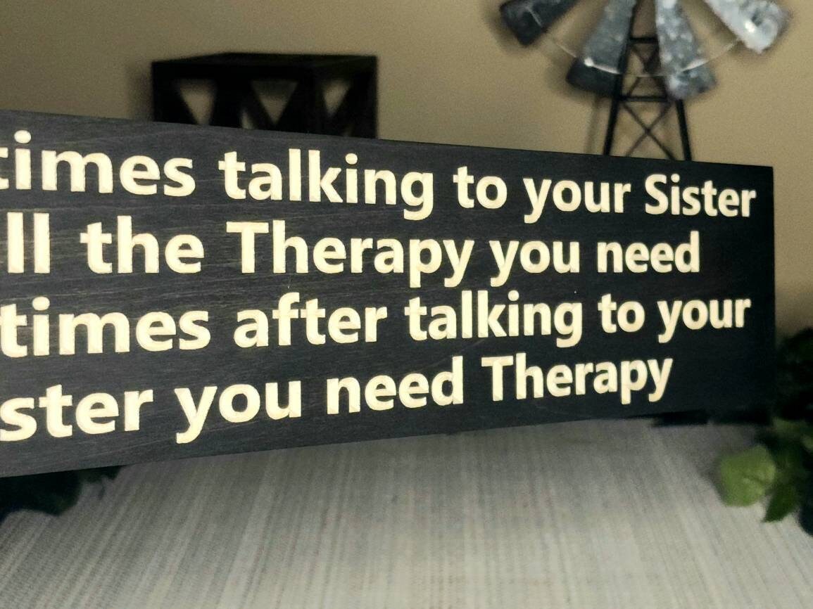 Personalized wooden sign gift for sisters with witty text and farmhouse style.
