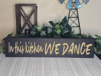 Playful kitchen decor with dancing quote sign for family kitchens.
