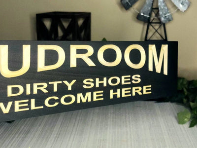 Practical and decorative mudroom welcome sign with a rustic aesthetic.