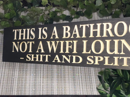 Quirky and sarcastic bathroom sign used as funny housewarming décor.
