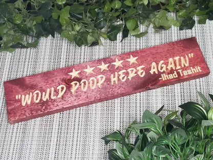 Quirky bathroom decor with humorous poop review wall art for playful homes.
