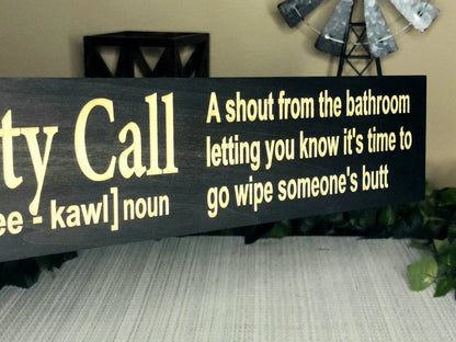 Quirky bathroom humor decor sign displayed as a housewarming gift for parents.
