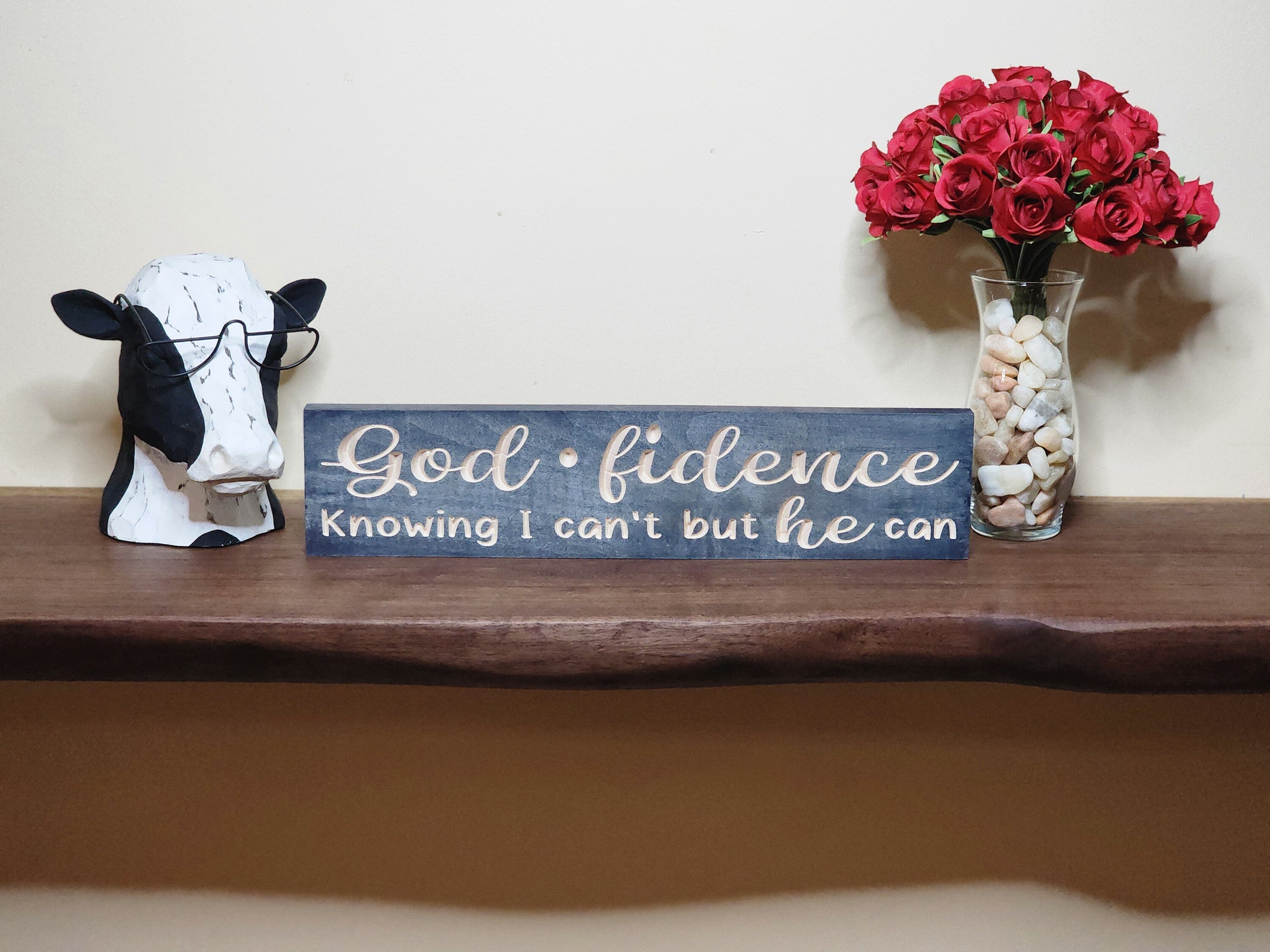 Rustic Christian wall art featuring the message Knowing I can't but He can.
