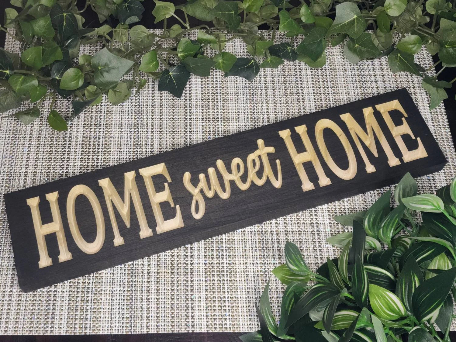 Rustic Home Sweet Home wooden sign displayed in a farmhouse entryway.
