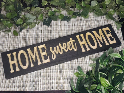 Rustic Home Sweet Home wooden sign displayed in a farmhouse entryway.
