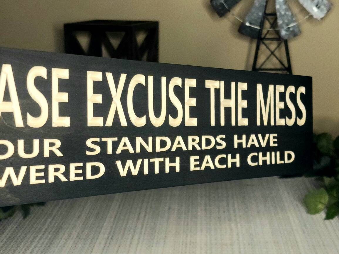 Rustic wood sign with a funny family quote perfect for moms and dads.
