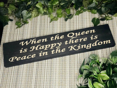 Rustic wooden sign reading When the Queen is Happy, There is Peace in the Kingdom.