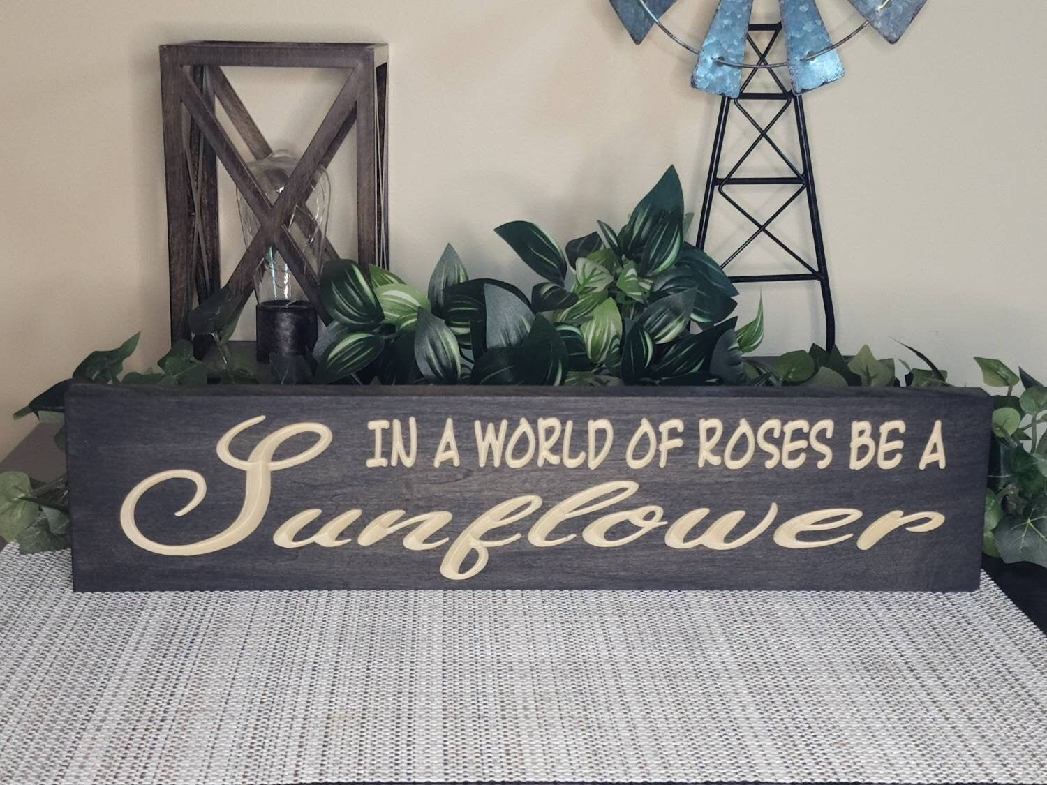Rustic wooden sunflower wall art styled in a modern farmhouse-inspired space.
