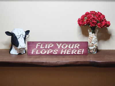 Rustic yard sign for poolside flip flop storage and patio organization.
