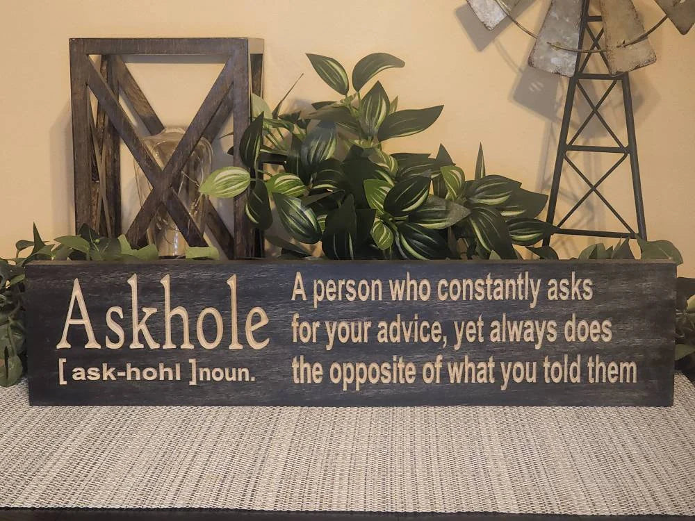 Sarcastic wall décor sign with a humorous quote about giving advice.
