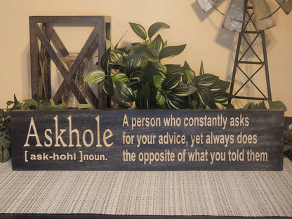 Sarcastic wall décor sign with a humorous quote about giving advice.
