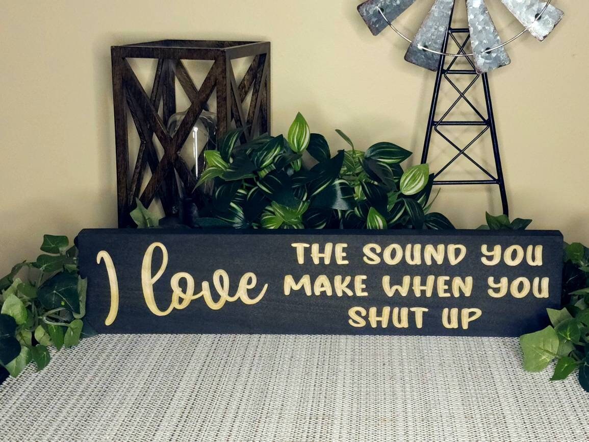 Sarcastic wooden wall sign with humorous quotes for living room or workspace.
