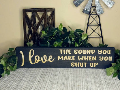 Sarcastic wooden wall sign with humorous quotes for living room or workspace.
