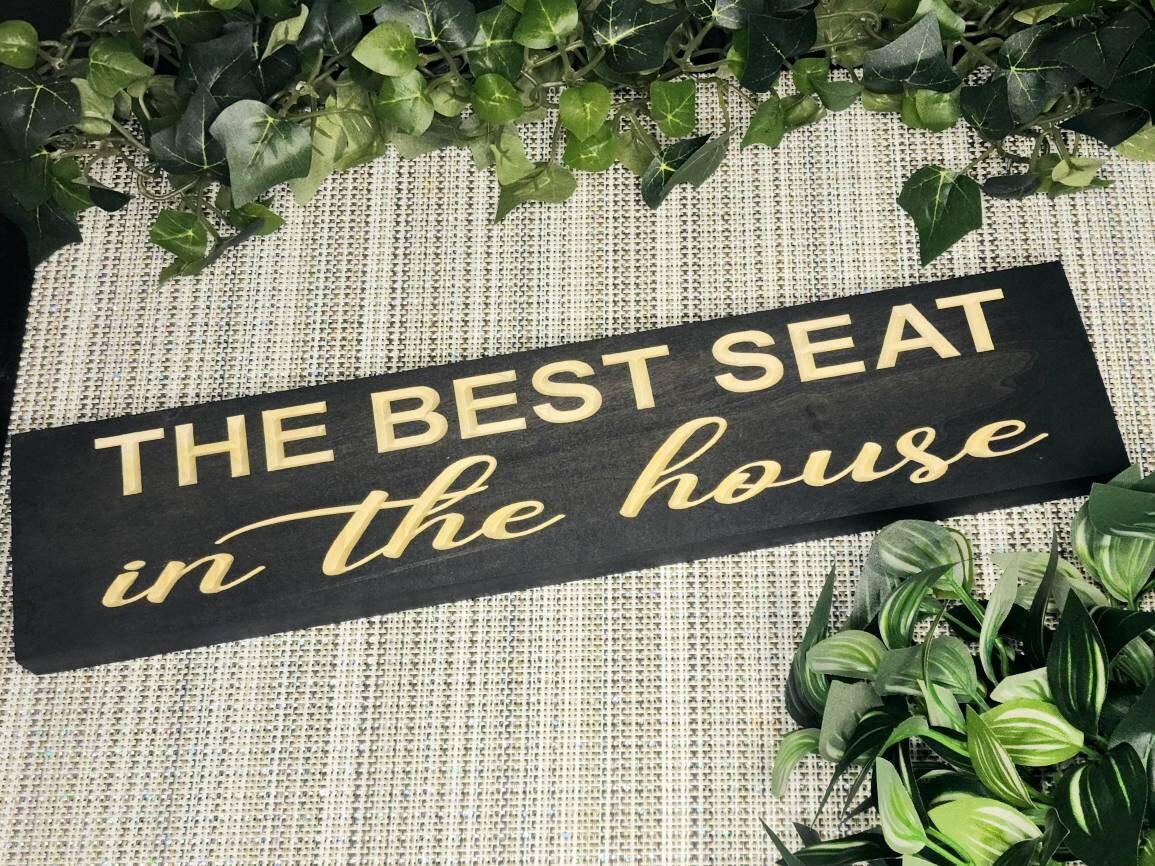 The Best Seat in the House wooden sign for humorous bathroom wall decor.
