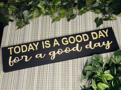"Today is a Good Day for a Good Day" wooden sign displayed in a bright and cozy entryway.
