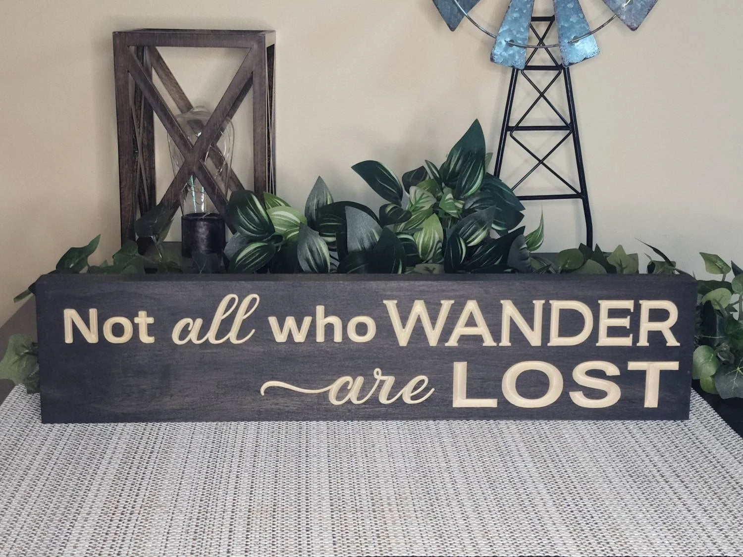 Travel-inspired wall art with a wanderlust quote, perfect for free-spirited home decor.

