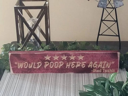 Unique wood bathroom sign with playful bathroom humor and quirky home accents.