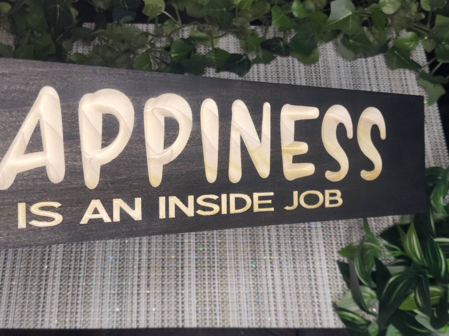 Uplifting wall art with a motivational message in a wellness-themed home setting.
