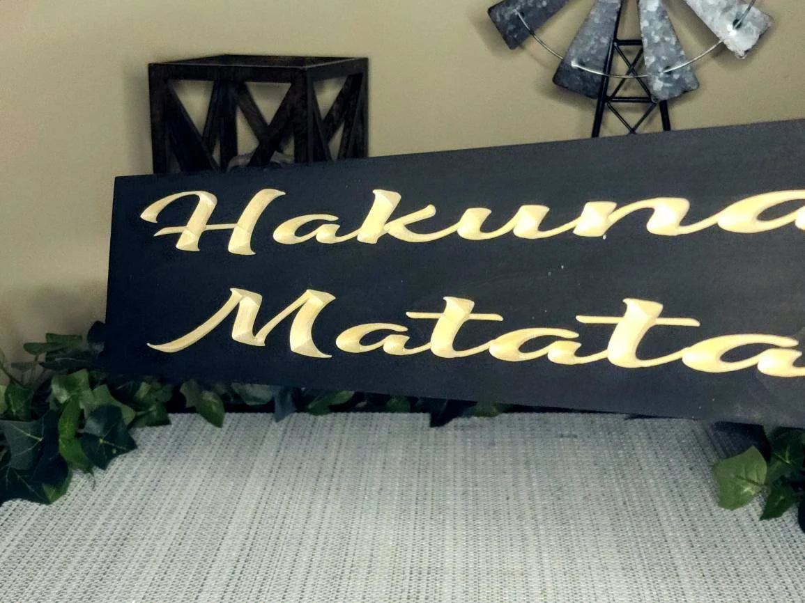 Wooden Hakuna Matata sign for nostalgic Disney home decor.
