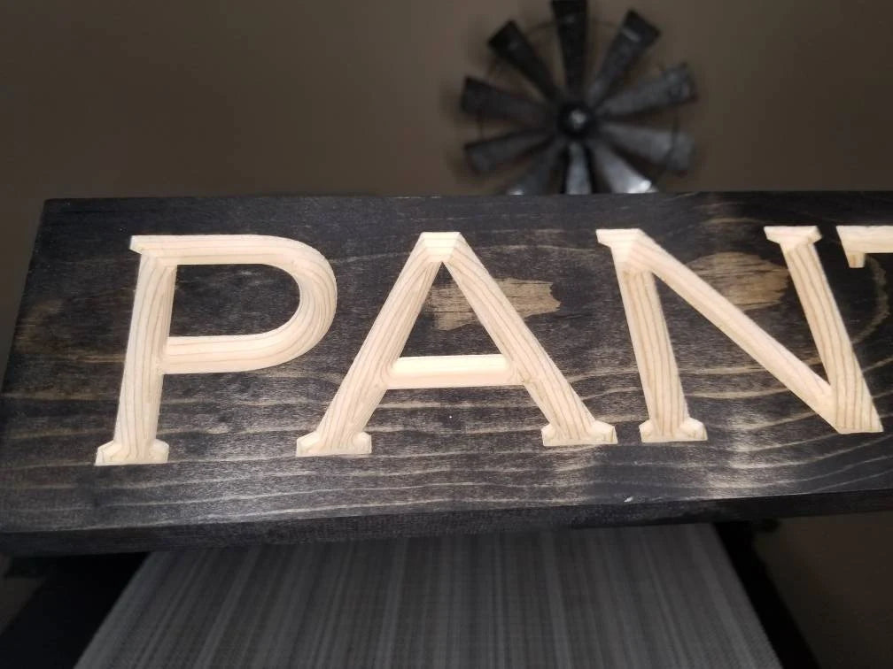 Wooden pantry door sign with rustic charm and farmhouse appeal.
