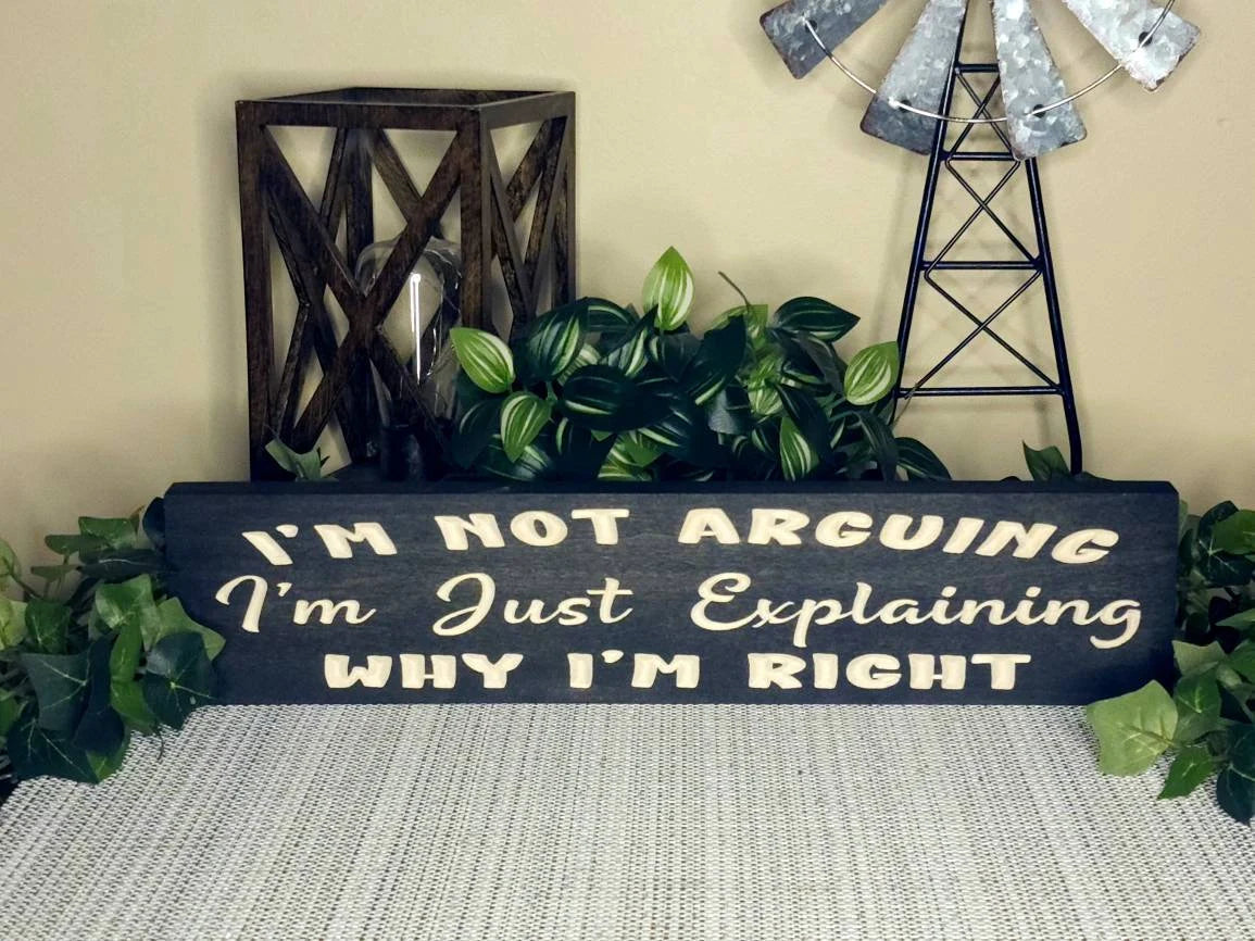 Wooden quote sign for humorous wall art in living rooms or offices.
