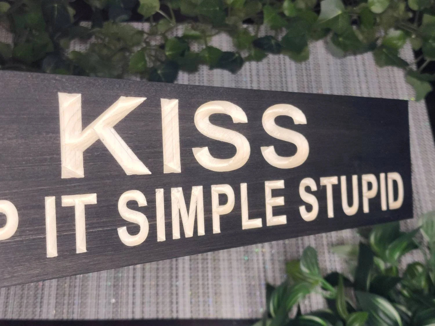Work motivation sign displayed in a modern workspace.
