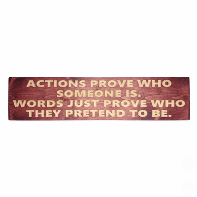 Motivational wood sign with deeply CNC carved "Actions Prove Who Someone Is, Words Just Prove Who They Pretend to Be" on solid pine in cabernet stain — handcrafted inspirational wall art from Bluegrass Gifts.