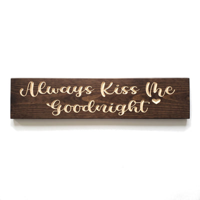 Always Kiss Me Goodnight sign carved into solid wood in a Dark Walnut stain, straight on, on a white background