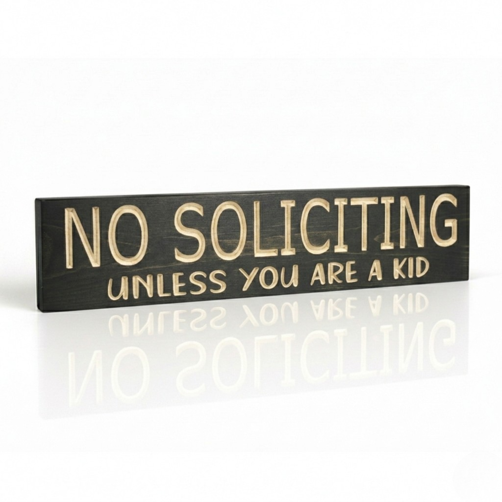Angled view of the charcoal wooden sign showing the 3D depth of the CNC-carved letters and professional side-lighting.