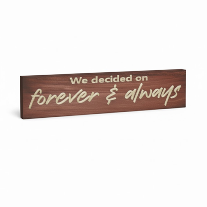 Angled view of carved “Forever & Always” wooden sign with engraved lettering